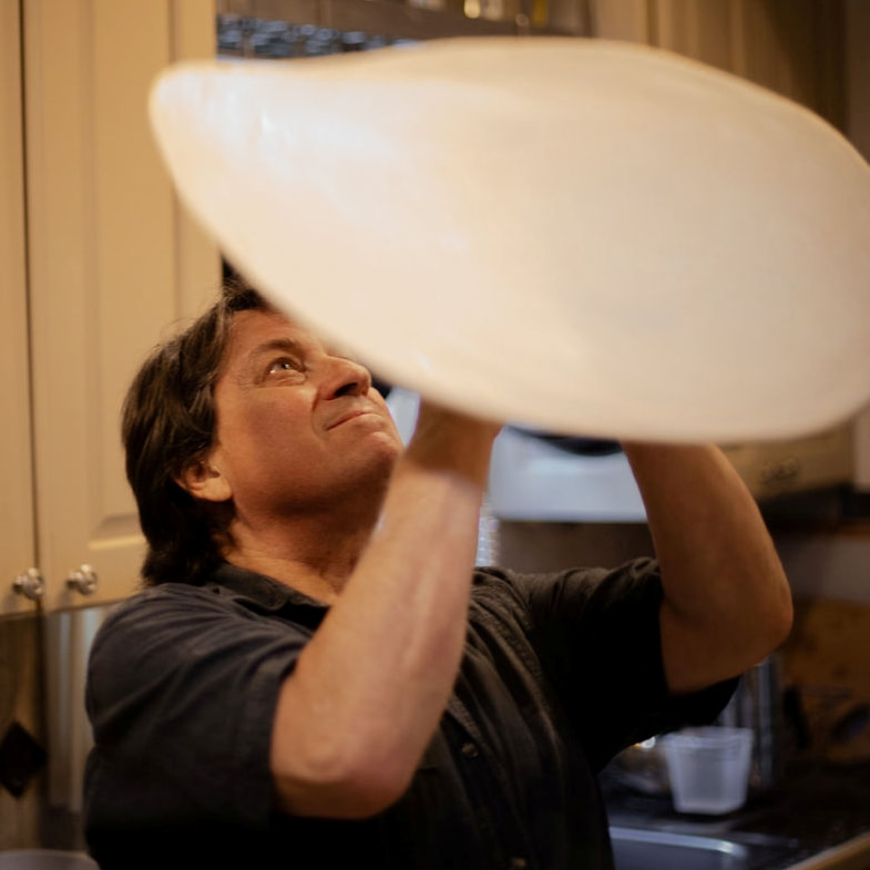 photo of Blaine Parker spinning pizza dough 