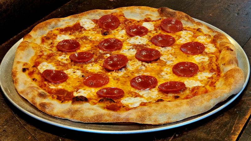 photo of a whole pepperoni pizza